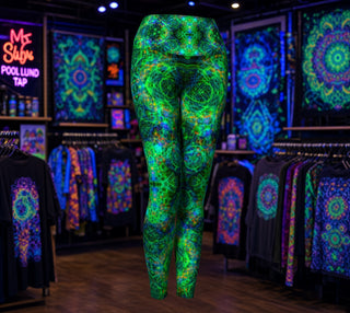 High-waisted leggings with an abstract, swirling fractal-like pattern in vibrant green, blue, and orange, shown on a neutral light gray background.