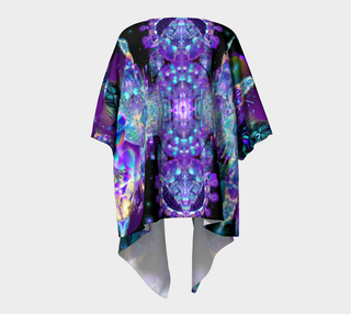 A short-sleeved kimono-style top with a vibrant, symmetrical psychedelic print in purple, blue, and black, shown against a light gray background.